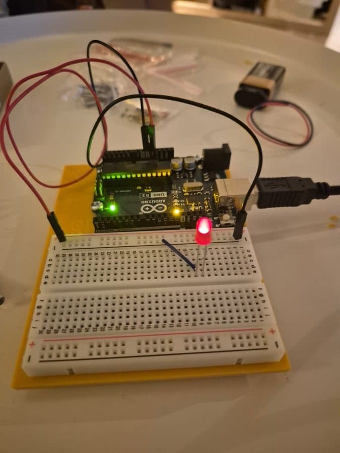 Arduino UNO R3 plugged into a breadboard with jumper wires