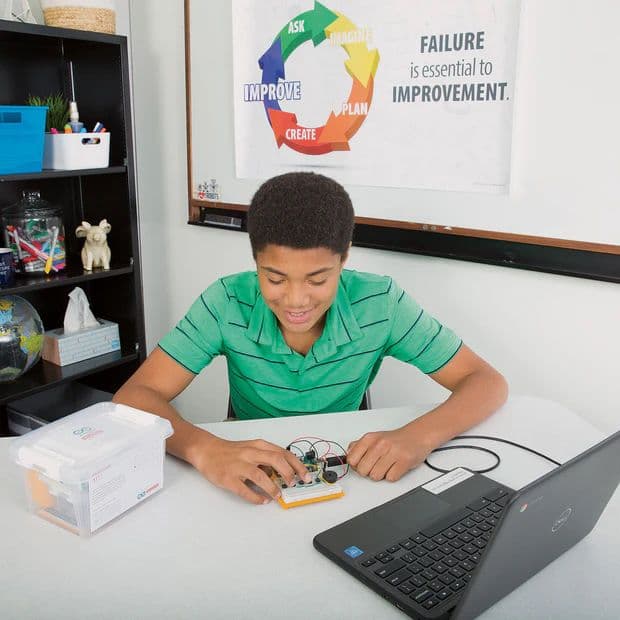 Teenager working with the Arduino Student Kit