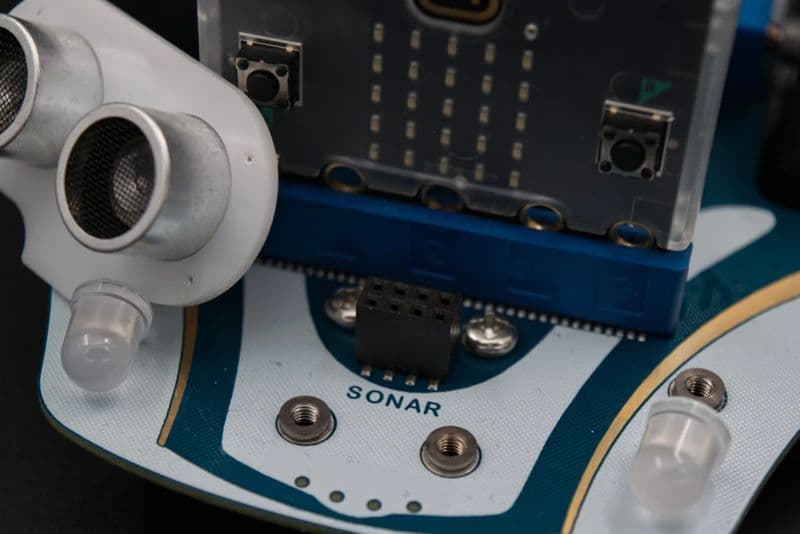 Close-up of the Cutebot Pro with BBC micro:bit and ultrasonic sonar sensor attached