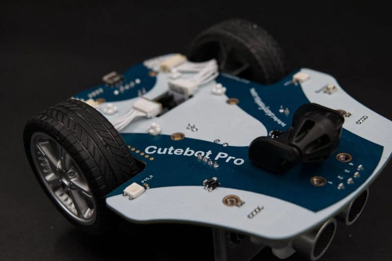 Underneath view of the Cutebot Pro showing the four line-following sensors and wider tires