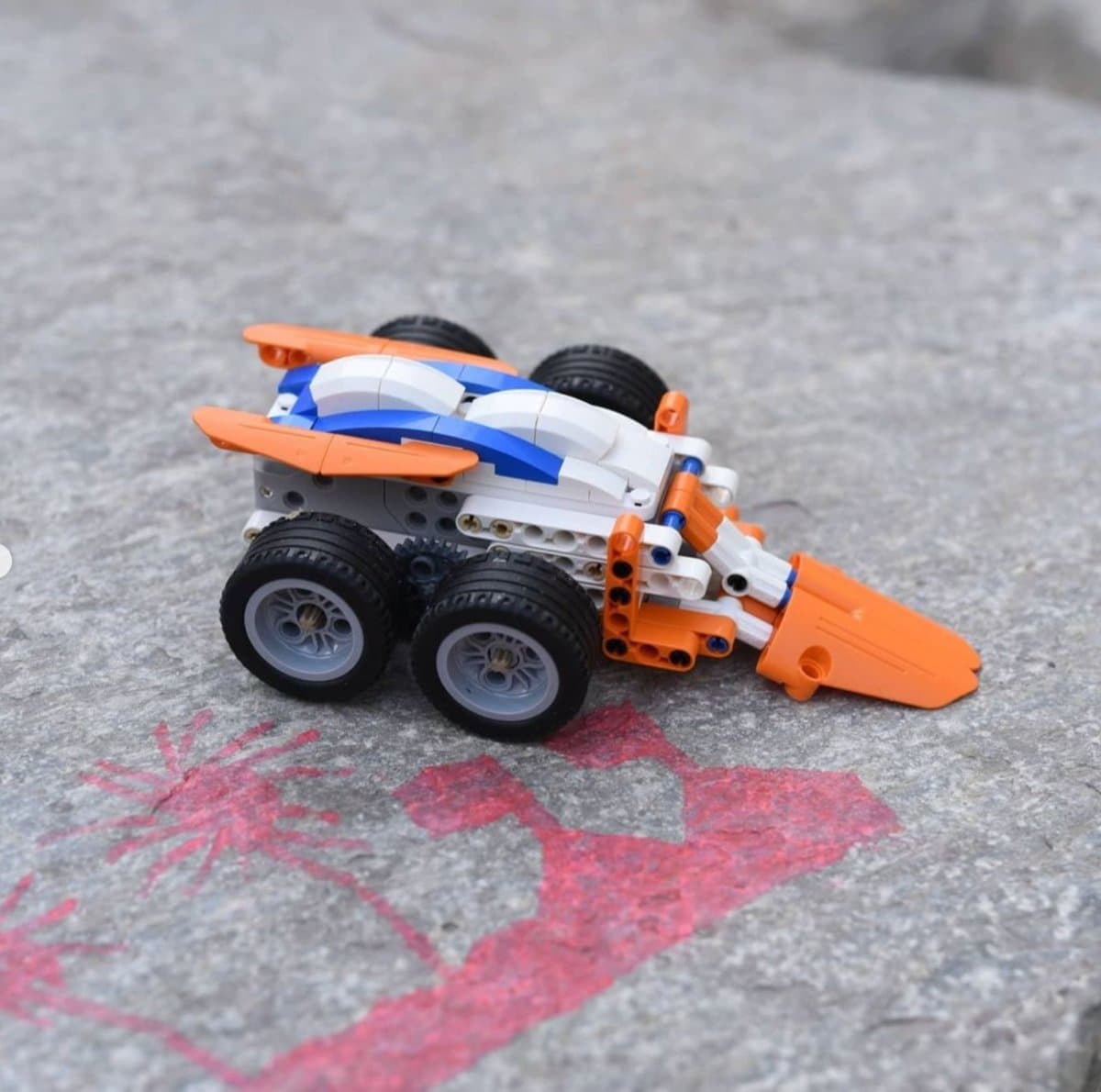 Makerzoid Superbot forklift robot build resting on a stone surface