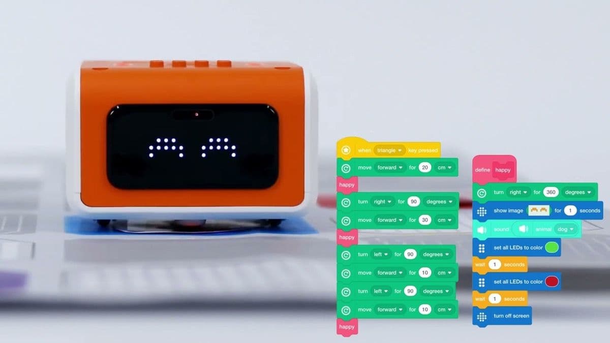 Child programming VinciBot on tablet with block-based coding