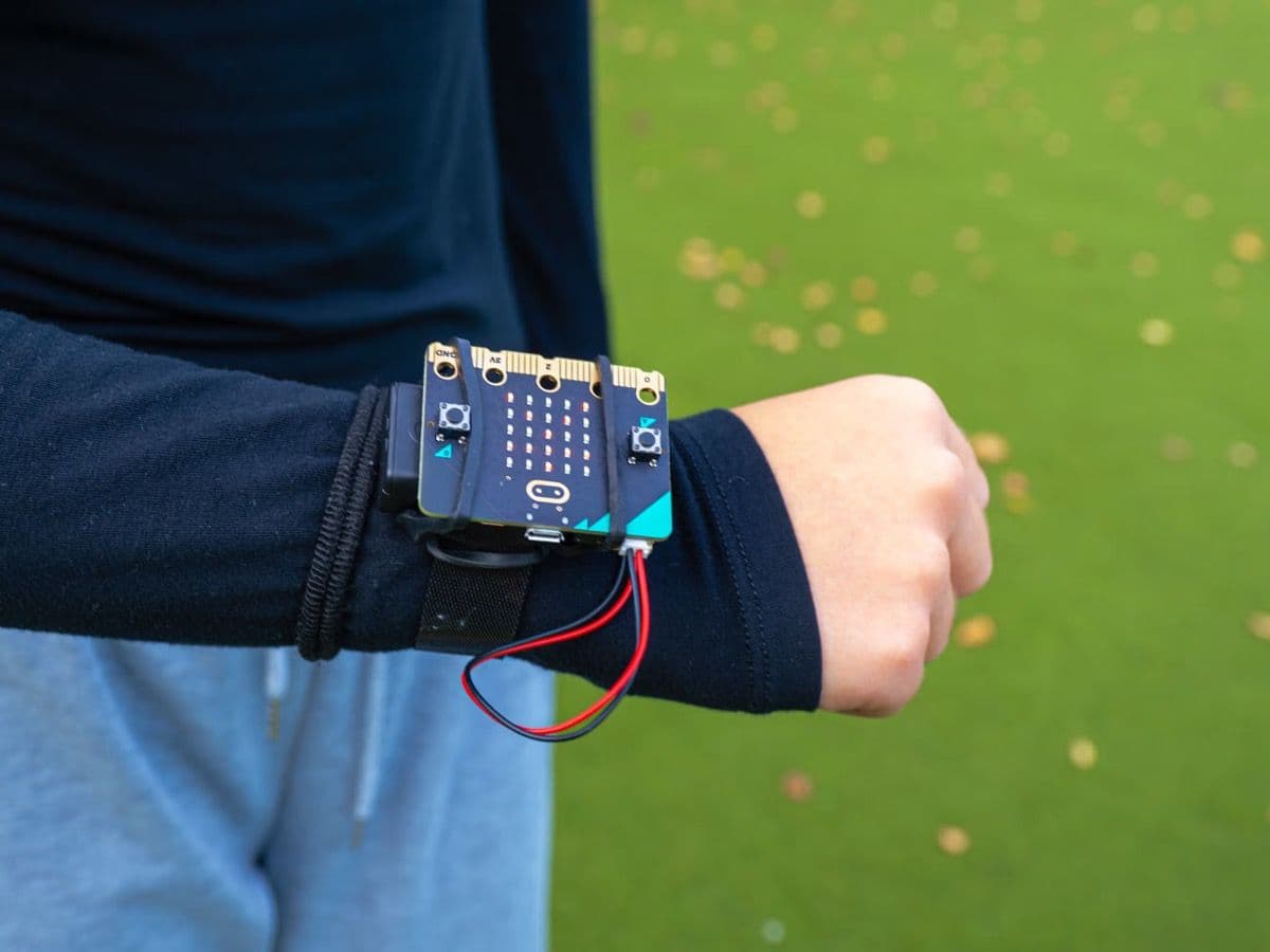 BBC micro:bit mounted on an arm using the official wearable strap
