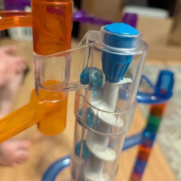 Close-up of the clear tube track pieces of the marble run